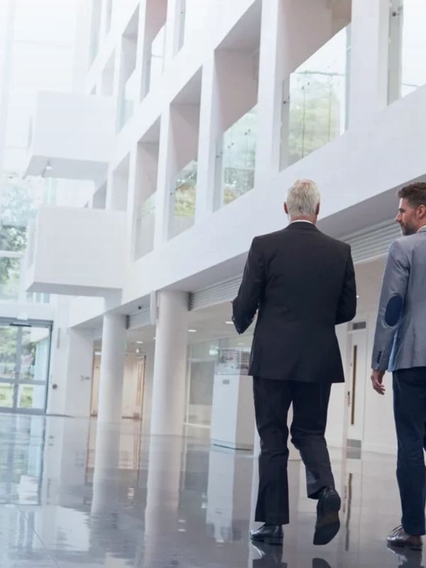 Businesspeople walking through an office